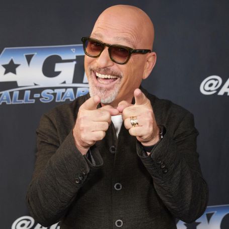 Howie Mandel posing for a photo shoot. 